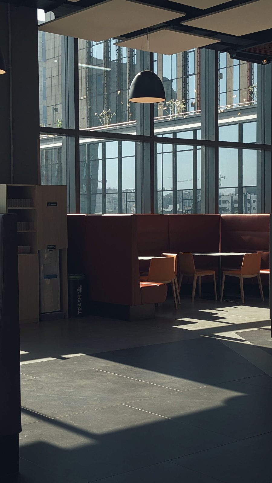 Sunlit commercial office interior with glazing and seating
